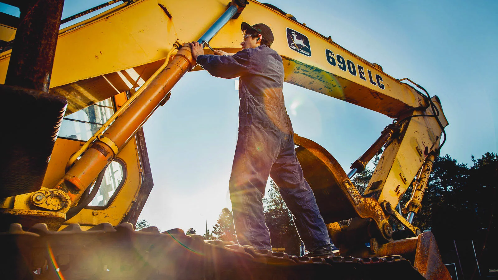 Heavy equipment service by Fixture International showing cranes and excavators on a construction site